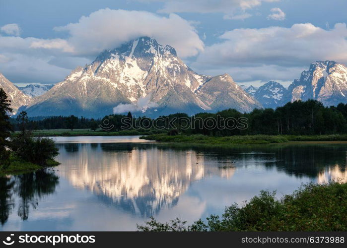 Grand Teton Mountains from Oxbow Bend on the Snake River at morning. Grand Teton National Park, Wyoming, USA.