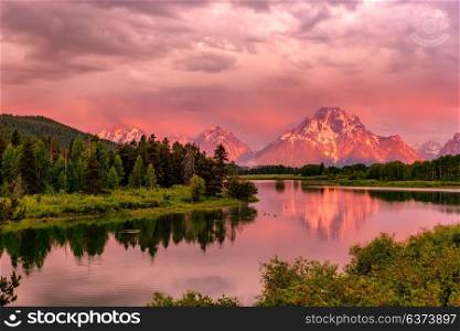 Grand Teton Mountains from Oxbow Bend on the Snake River at sunrise. Grand Teton National Park, Wyoming, USA.