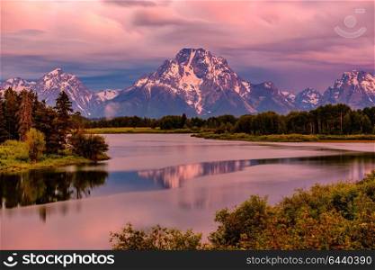Grand Teton Mountains from Oxbow Bend on the Snake River at sunrise. Grand Teton National Park, Wyoming, USA.