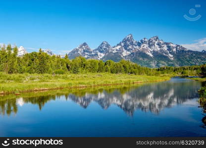 Grand Teton Mountains from Schwabacher&rsquo;s Landing on the Snake River at morning. Grand Teton National Park, Wyoming, USA.