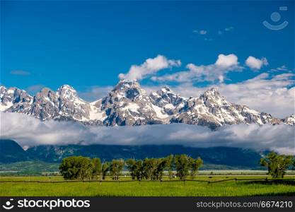 Grand Teton Mountains with low clouds. Grand Teton Mountains with low clouds. Grand Teton National Park, Wyoming, USA.