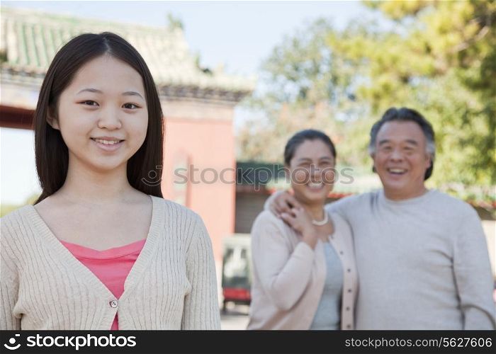 Granddaughter with grandparents, portrait