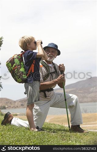 Grandfather and grand-son bird watching