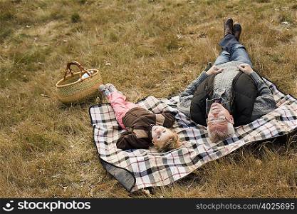 grandfather and granddaughter at picnic