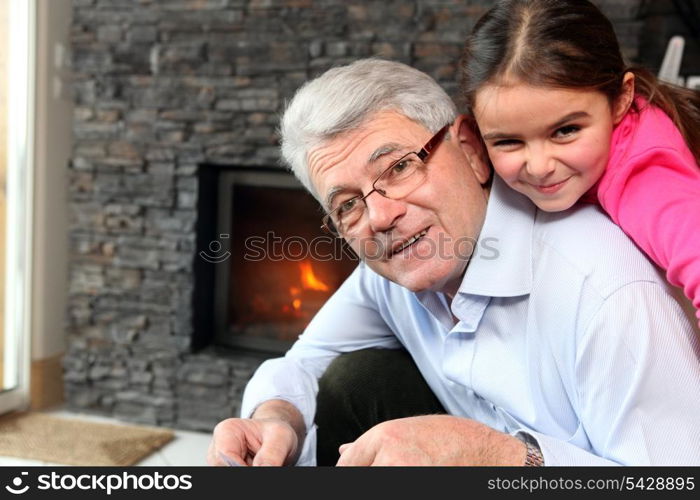 Grandfather and granddaughter playing