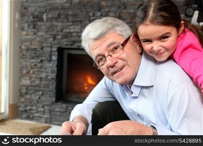 Grandfather and granddaughter playing