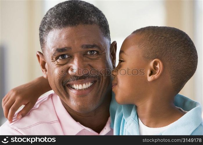 Grandfather and grandson hugging.