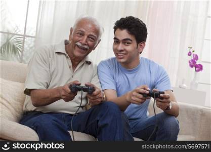 Grandfather and grandson playing video game