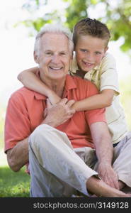 Grandfather and grandson smiling.