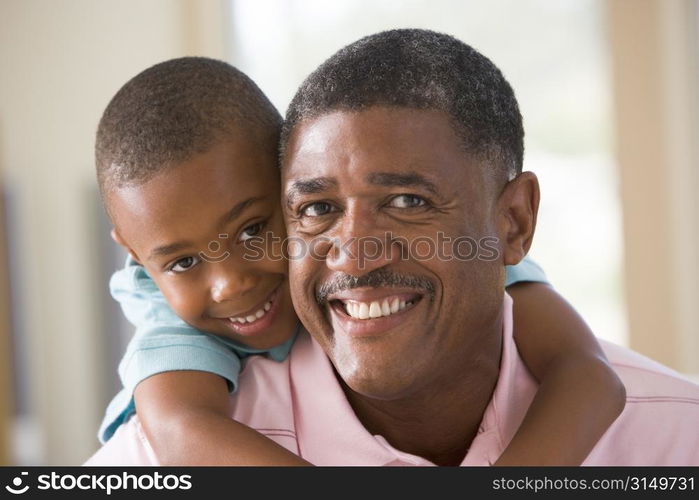 Grandfather and grandson smiling