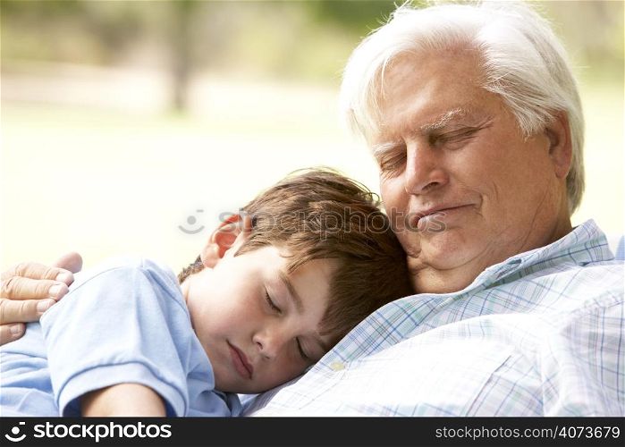 Grandfather And Grandson Taking Nap Together