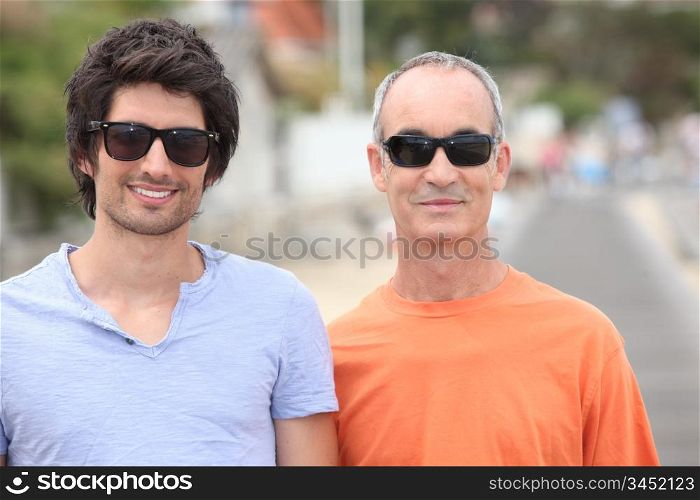 Grandfather and grandson with sunglasses