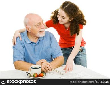 Grandfather and teen granddaughter enjoy spending time together. Isolated on white.