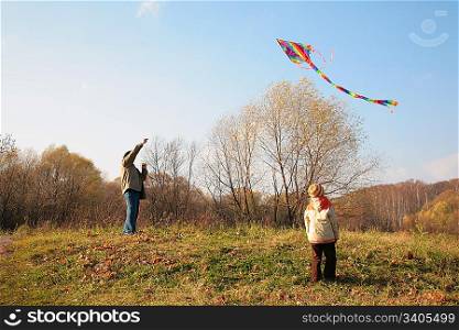 Grandfather and the grandson start a kite