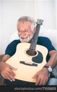 Grandfather hugged the guitar and smiled.