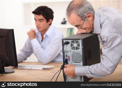 Grandfather installing computer
