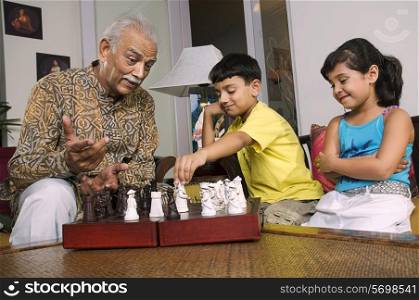 Grandfather playing with grandchildren