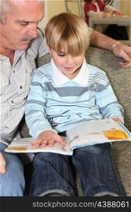 grandfather reading with his grandson