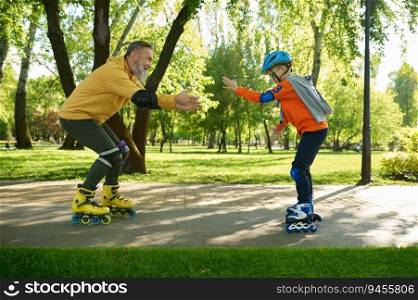Grandfather teaching grandson riding roller skates in city park. Happy family enjoying fun time and active sport recreation outdoors. Grandfather teaching grandson riding roller skates in city park