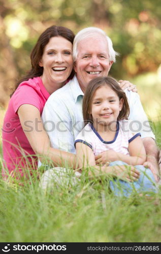 Grandfather With Daughter And Granddaughter In Park