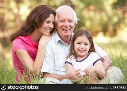 Grandfather With Daughter And Granddaughter In Park