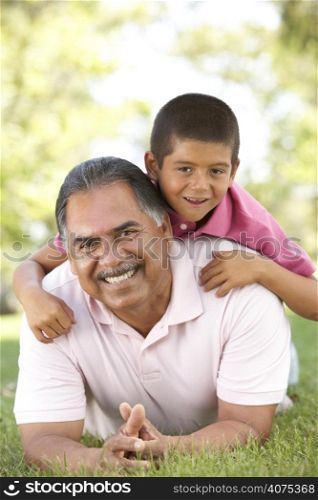 Grandfather With Grandson In Park