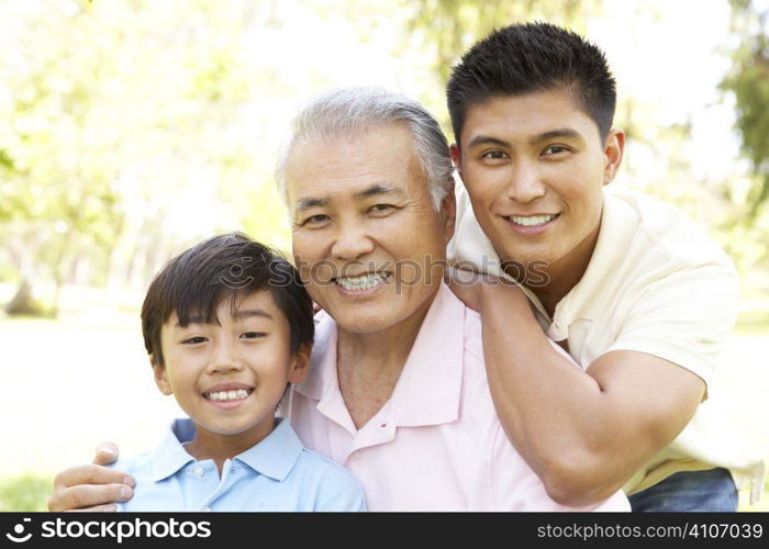 Grandfather With Son And Grandson In Park