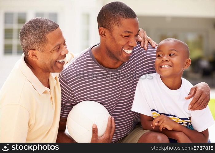 Grandfather With Son And Grandson Playing Volleyball