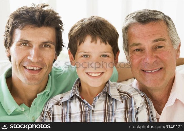 Grandfather with son and grandson smiling.