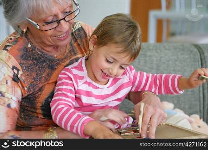 Grandma and granddaughter playing a game