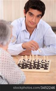 Grandma playing chess with grandson