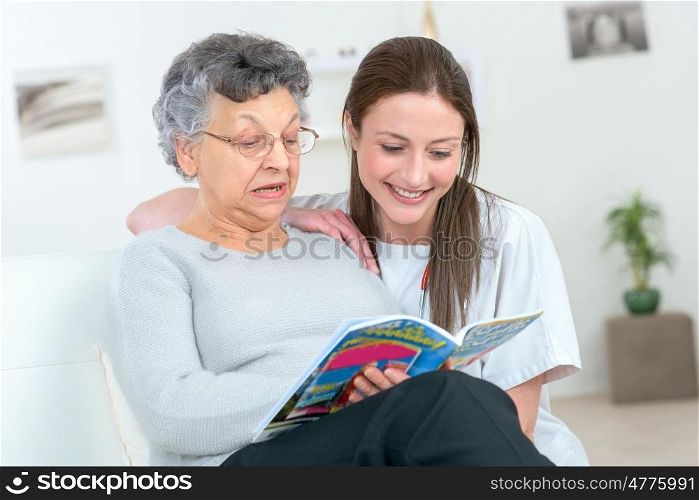 grandmother and grandaughter reading at home