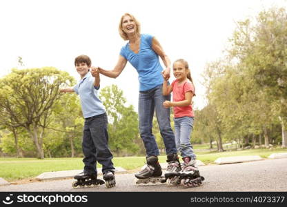 Grandmother And Grandchildren Skating In Park