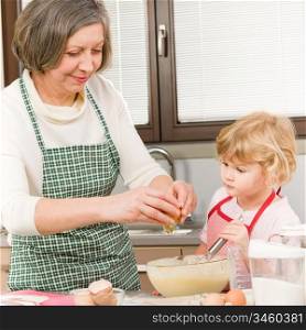 Grandmother and granddaughter baking cookies prepare dough