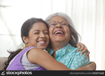 Grandmother and granddaughter hugging each other