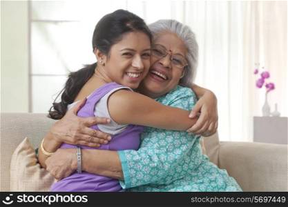 Grandmother and granddaughter hugging each other