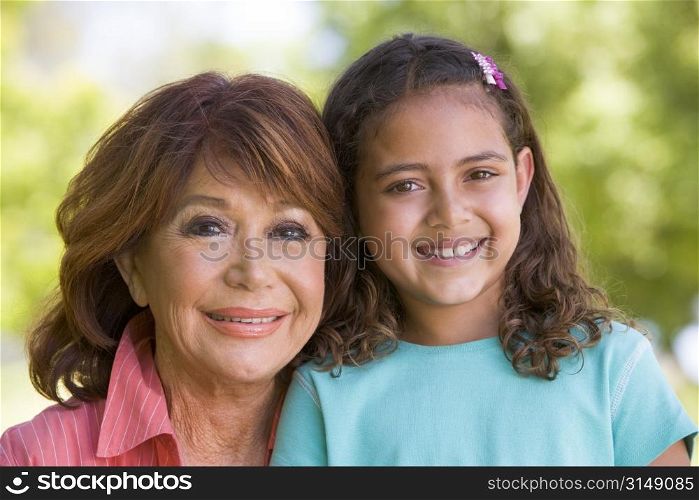 Grandmother and granddaughter smiling