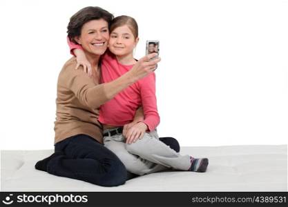 grandmother and granddaughter taking a picture of themselves