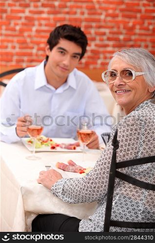 Grandmother and grandson at restaurant