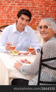 Grandmother and grandson at restaurant