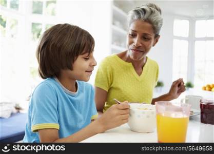 Grandmother And Grandson Having Breakfast Together