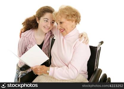 Grandmother and teen girl reading a get well card or mothers day card together. Isolated on white.