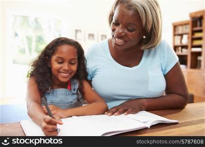 Grandmother Helping Granddaughter With Homework