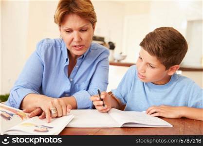 Grandmother Helping Grandson With Homework