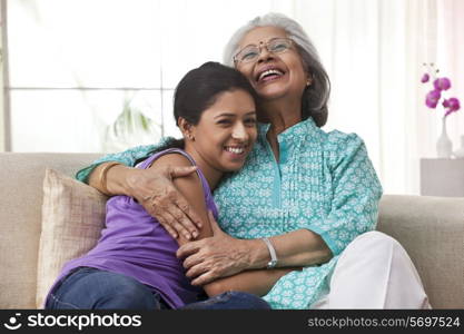 Grandmother hugging her granddaughter