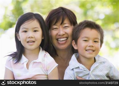 Grandmother laughing with grandchildren.