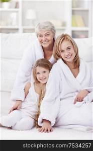 Grandmother, mother and daughter in the morning in an apartment