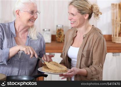Grandmother offering crepes