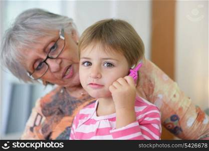 Grandmother playing with a child