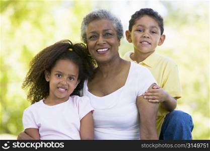 Grandmother posing with grandchildren.